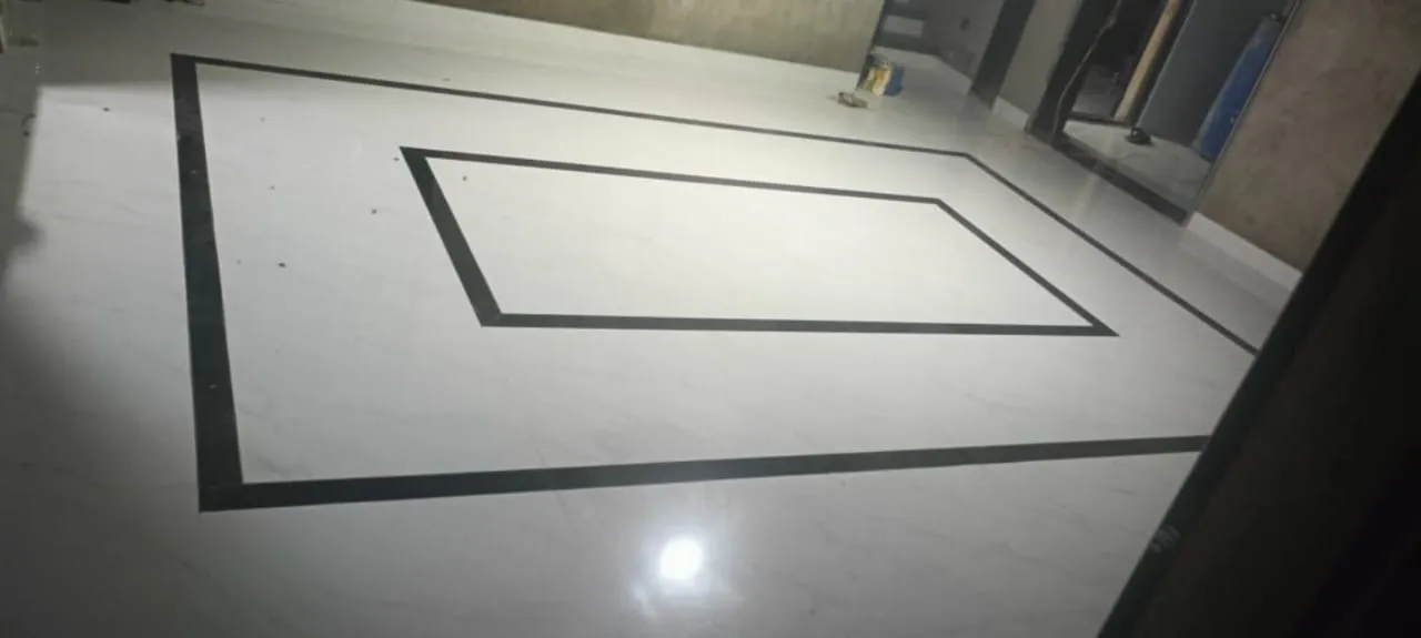 Marble-look floor with black granite inlay border